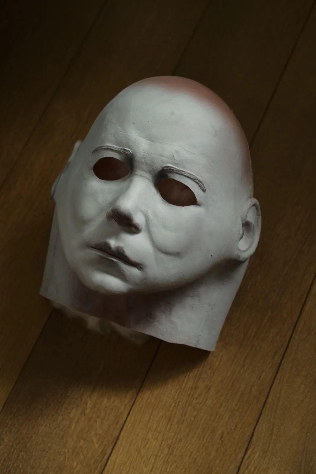 Dark Labs Cosmic Shape 78 mask on the floor showing weathered face and brow detail