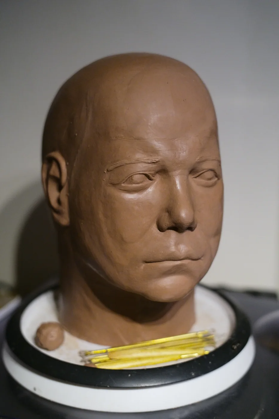 Dark Labs Kirk clay sculpt from the opposite three-quarter angle on the workbench