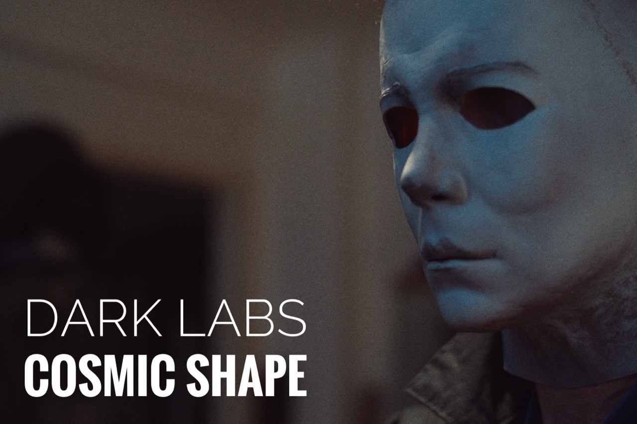 Cosmic Shape worn close angled view in cool lighting with Dark Labs branding